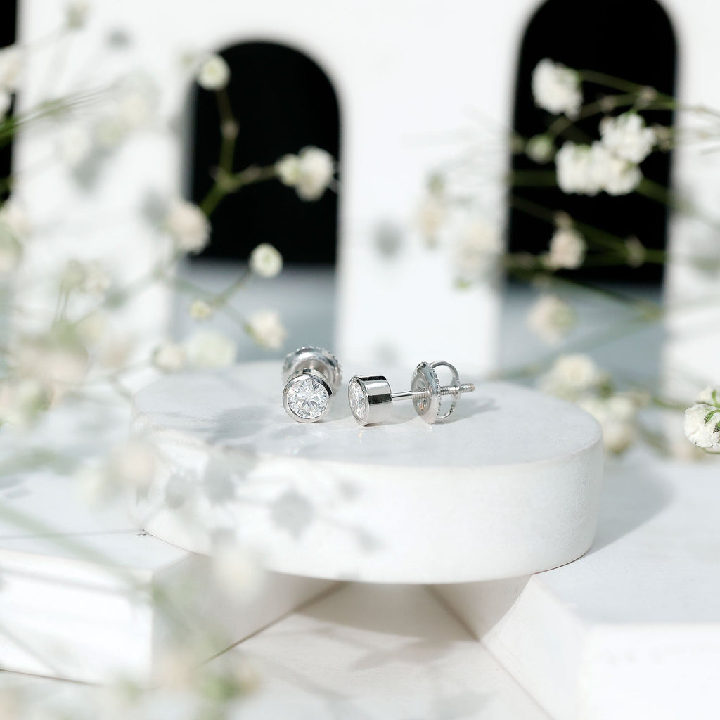 Certified 0.6 Carat Moissanite Stud Earrings in Bezel Setting