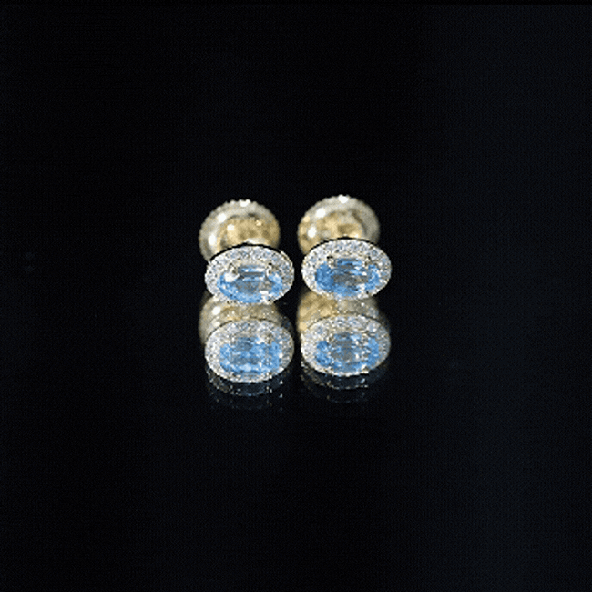 Pendientes de topacio azul suizo natural con halo de diamantes