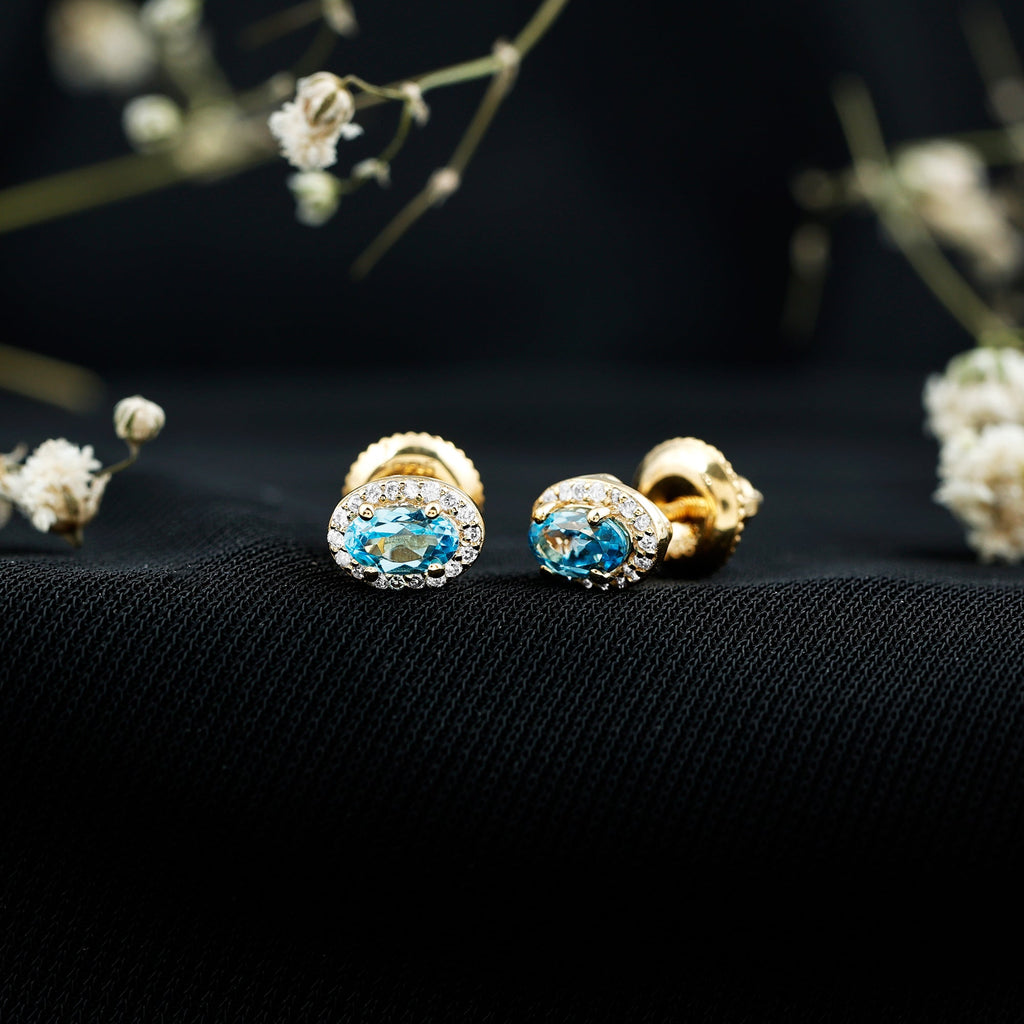 Pendientes de topacio azul suizo natural con halo de diamantes